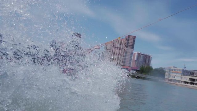 a young guy is riding a hydrocycle on the lake
