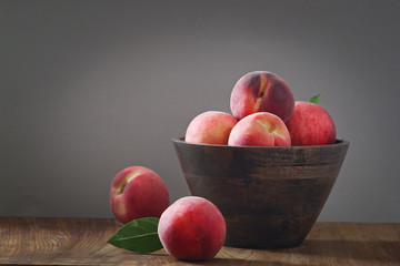 peaches on wooden background.