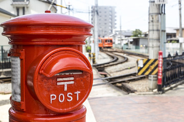 Fototapeta na wymiar Red mailbox in countryside of Japan.