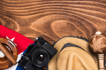 Objects related to Cuba on wooden background