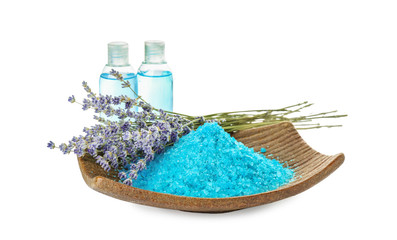 Obraz premium Plate with sea salt, cosmetics for spa procedures and beautiful lavender on white background