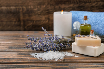 Obraz na płótnie Canvas Composition with spa cosmetics and lavender on wooden table