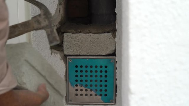 builder hacking of wall