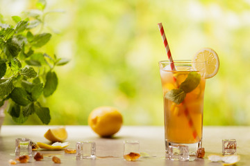 Iced tea with lemon and ice cubes