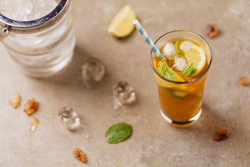 Iced tea with lemon and ice cubes