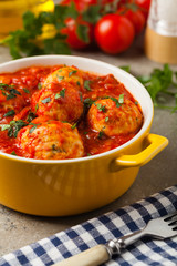 Chicken meatballs with tomato sauce. Served with rice.