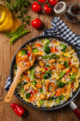 Nasi goreng. Fried rice with egg and vegetables.