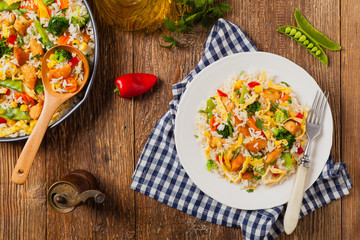 Nasi goreng. Fried rice with egg and vegetables.