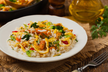 Nasi goreng. Fried rice with egg and vegetables.