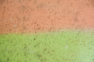 Background concrete wall, traces of weathering, worn wall damaged paint old paint. Remains of old paint on the painted concrete surface. Grungy destruction surface.