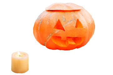 Carved pumpkin on Halloween isolated on white background. Funny and scary muzzle of a pumpkin and a blocked candle. Place and background for text
