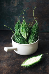 Wild Bitter Gourd, Bitter Cucumber, Bitter Gourd on rustic background