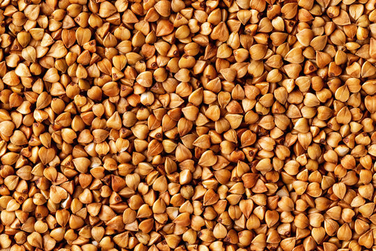 Macro image of buckwheat grain as a natural vegan food background.