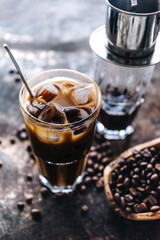 Traditional Vietnamese milk coffee on rustic background