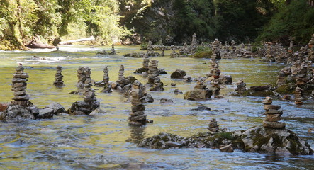 Human made piles of stones near a river