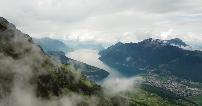 Aerial drone shot of Lake Lucerne with fog and mist