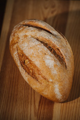 Healthy organic homemade bread on wooden table.