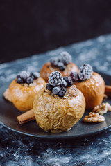 Fruit dessert baked  apples stuffed with blackberry, blueberries, cinnamon, nuts, honey.