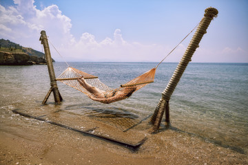Rest at the resort. Bungalow, hammock, beach, swimming pool.