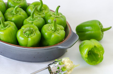 Raw and Fresh Green Organic Bell Peppers On White Background.