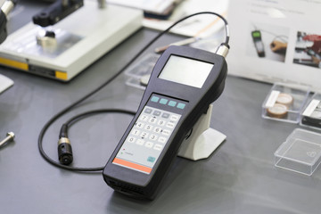 QC operator calibrate thickness testing machine before inspection painting quality and coating...