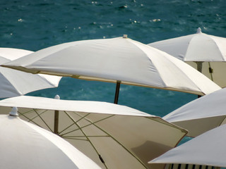 Cannes - White umbrellas on a beach