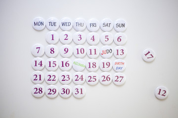 Collected calendar of round magnets. Monthly Planning