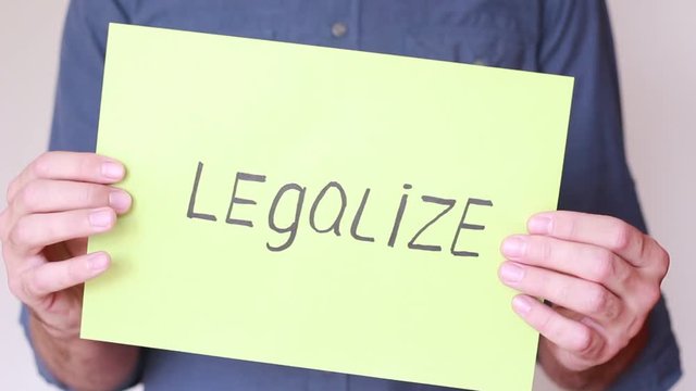 "Legalize" inscrition in male hands
