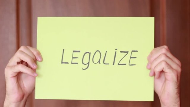 "Legalize" inscription on color paper