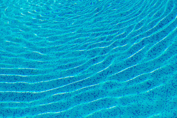 Bright blue surface swimming pool water background