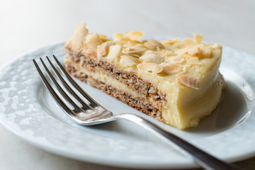 Slice of Swedish Almond Cake served with Plate.