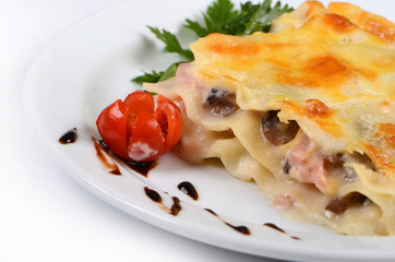 Piece of Lasagne isolated on white background