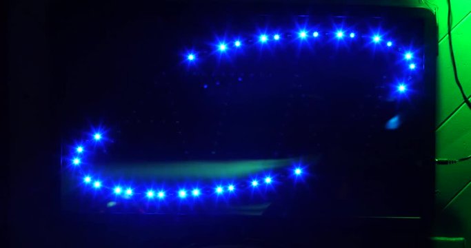 Close up of a flashing light up ATM sign, automated teller machine