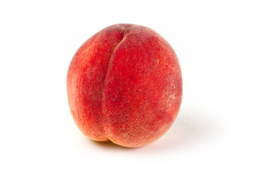 Peach juicy bright and beautiful shot close-up on a white background