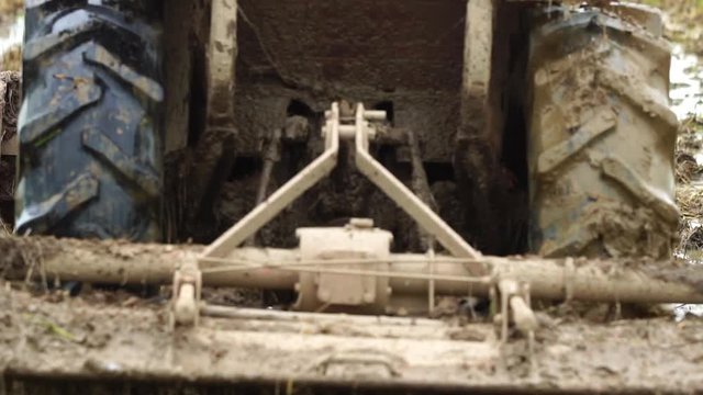 Slow motion : People using  big tractor in rice field