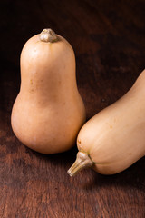 butternut squash over old wood background