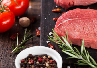 Fresh raw beef steak meat on wooden board