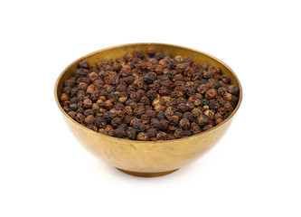 One bronze metal bowl full of black peppercorns