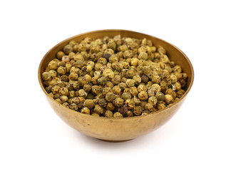 One bronze metal bowl full of green peppercorns