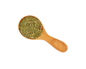 Wooden scoop spoon full of dried herbs spice
