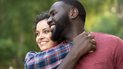 Happy multiethnic couple, celebrate diversity, no to racism and discrimination