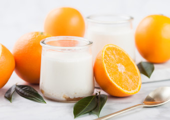 Fresh cream dessert yogurt with raw oranges