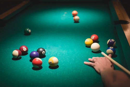 Man playing snookers in the night club