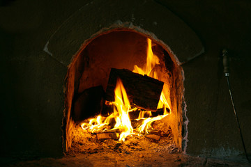 Fireplace. Burning firewood.