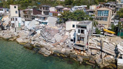 Fototapeta na wymiar The destroyed house after the earthquake on the seashore