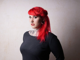 young woman with piercings and tattoos