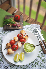 Appetizer chicken kebab with vegetables, top view