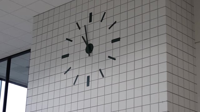 A pan shot of a large wall mounted clock. (This clip was shot on my Canon 80D with a 50mm f/1.8 prime lens in FullHD (1920x1080) in 60 fps, and slowed down to 24 fps in FCPX.)