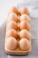 Farm raw fresh egg in pack on gray table ingredient for breakfast preparation scrambled eggs omelet fried egg