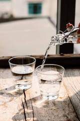 Pouring water into a glass © makistock